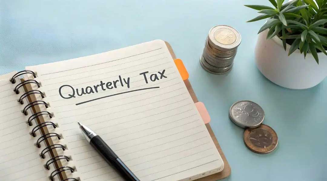notebook with "quarterly tax" written in it